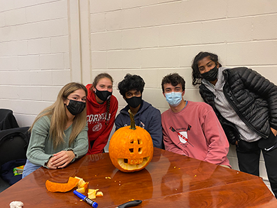 Pumpkin carving with project team.