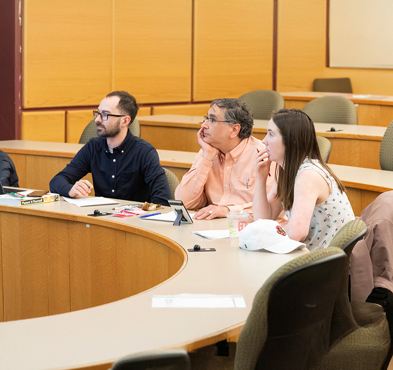 Design course faculty Nate Cira, James Antaki and Alexandra Werth enjoy student team final presentations.