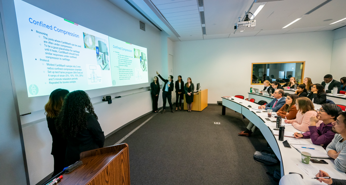 students presenting to audience in classroom